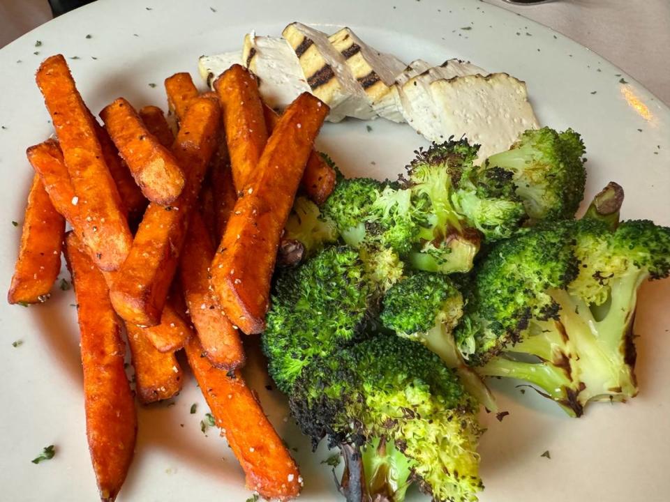 A grilled tofu dinner with broccoli and sweet potato fries at Cat City Grill in Fort Worth.