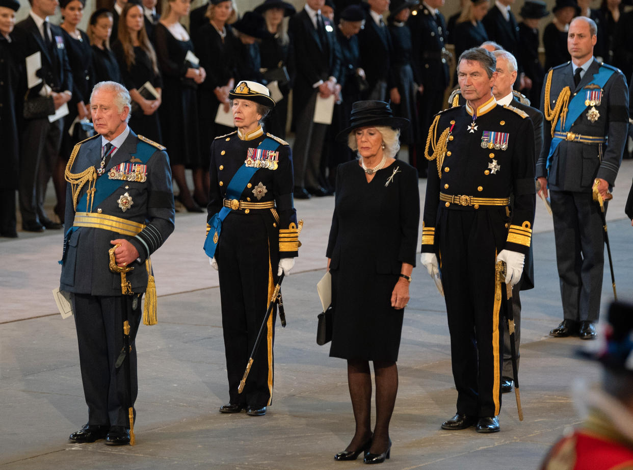 King Charles III, Princess Anne, Camilla, Queen Consort, Vice Admiral Sir Timothy Laurence pay their respects in the Palace of Westminster during the procession for the Lying-in State of Queen Elizabeth II on Sep. 14, 2022 in London, England. (David Ramos / Getty Images)