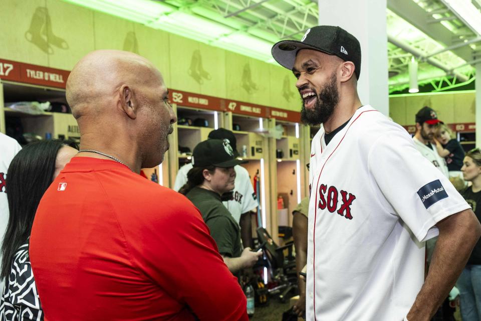 BOSTON, MA - JUNE 24: Coach Alex Cora of the Boston Red Sox speaks with Derrick White #9 of the Boston Celtics before a pre-game ceremony recognizing the NBA Finals Championship before a game between the Boston Red Sox and the Toronto Blue Jays on June 24, 2024 at Fenway Park in Boston, Massachusetts.  (Photo by Billie Weiss/Boston Red Sox/Getty Images)