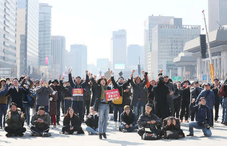 People react about the decision of the Constitutional Court over the impeachment of South Koeran President Park Geun-hye in Seoul, South Korea March 10, 2017. Yonhap/Lee Ji-Eun/via REUTERS