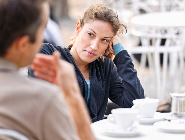 Woman looking bored on a coffee date