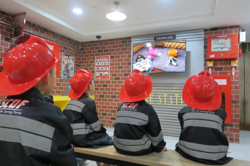 kidzania singapore re-opens - scdf kids watching simulation