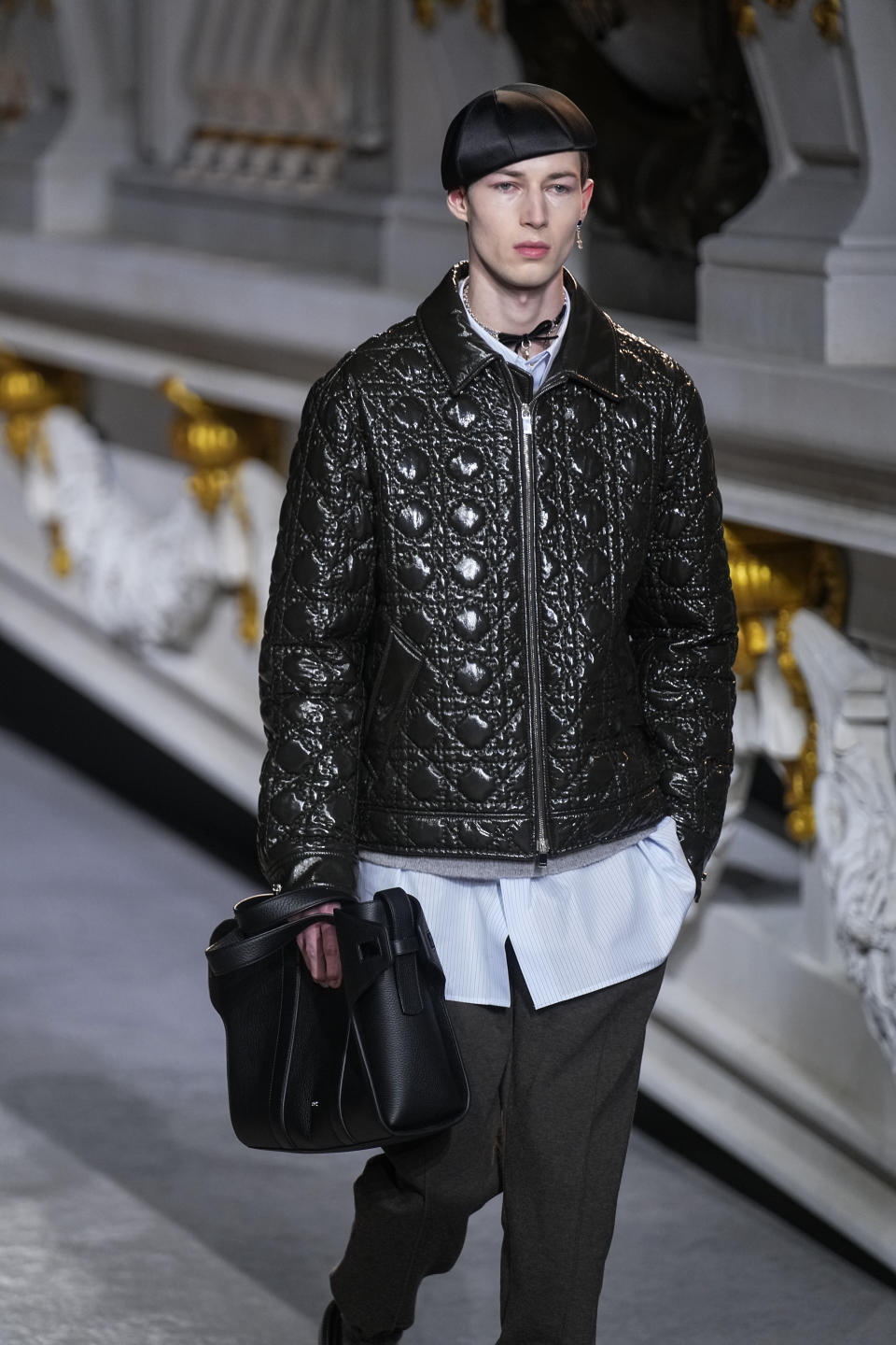 A model wears a creation for the Dior fall-winter 22/23 men's collection, in Paris, Friday, Jan. 21, 2022. (AP Photo/Michel Euler)