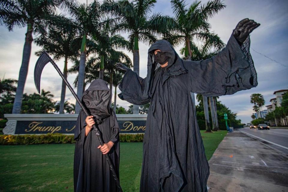 The - Grim Reaper, - Florida Lawyer Daniel W Uhlfelderat with his daughter Daisy visits Trump National Doral to raise awareness of new cases of COVID in Florida that he says is due to the failure of President Donald Trump and Florida Governor Ron DeSantis to prevent the spread of the pandemic on Saturday, June 20, 2020 in Miami.