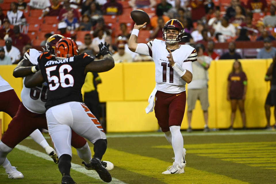 Washington Commanders quarterback Jake Fromm (11) attempts a pass against the Cincinnati Bengals during the second half at FedExField. Mandatory Credit: Brad Mills-USA TODAY Sports