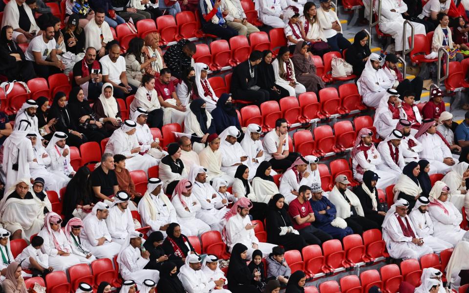 Empty seats in between fans during the FIFA World Cup Qatar 2022 Group A match between Qatar and Ecuador - AMA/Getty Images