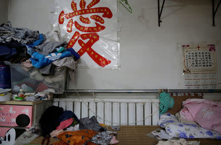 Radiators are placed next to a bed in Yao Guanghui's bedroom at Xiaozhangwan village of Tongzhou district, on the outskirts of Beijing, China June 28, 2017. Picture taken June 28, 2017. REUTERS/Jason Lee