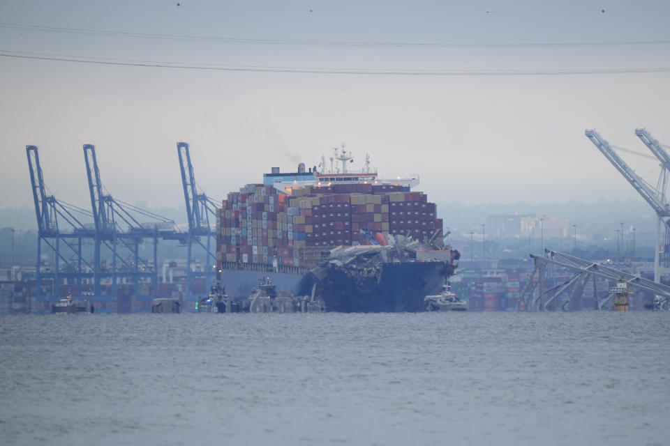 Crews work to move the cargo ship Dali in Baltimore, Monday, May 20, 2024. The vessel on March 26 struck the Francis Scott Key Bridge causing it to collapse and resulting in the death of six people. (AP Photo/Matt Rourke)