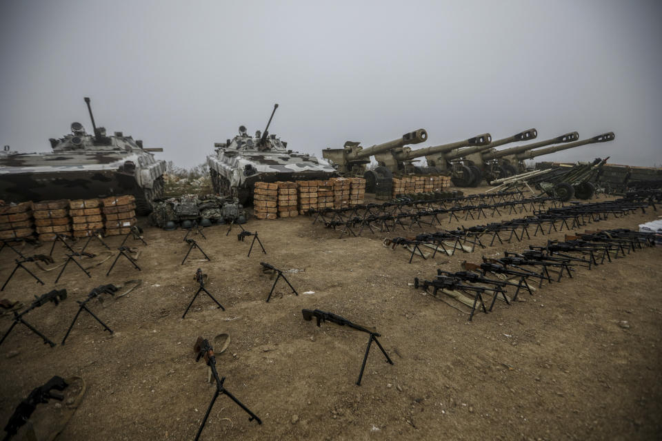 Weapons and equipment surrendered by Armenian forces in Nagorno-Karabakh are displayed in Signag village, Azerbaijan, Sunday, Oct. 1, 2023. Armenian forces in Nagorno-Karabakh laid down their weapons after a lightning military operation in which Azerbaijan reclaimed control of the breakaway region after three decades of separatist rule. (AP Photo/Aziz Karimov)