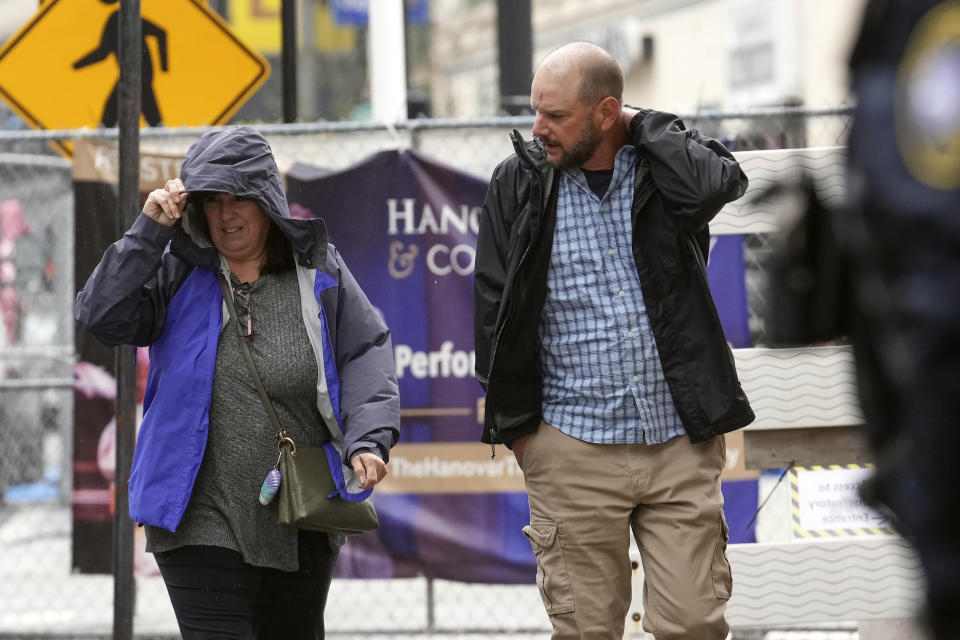 ADDS ID - Jack Michael Teixeira, right, father of Massachusetts Air National Guardsman Jack Teixeira, arrives at federal court, Thursday, April 27, 2023, in Worcester, Mass. Jack Teixeira has been charged with leaking highly classified military documents. Teixeira has been charged under the Espionage Act with unauthorized retention and transmission of classified national defense information. (AP Photo/Steven Senne)