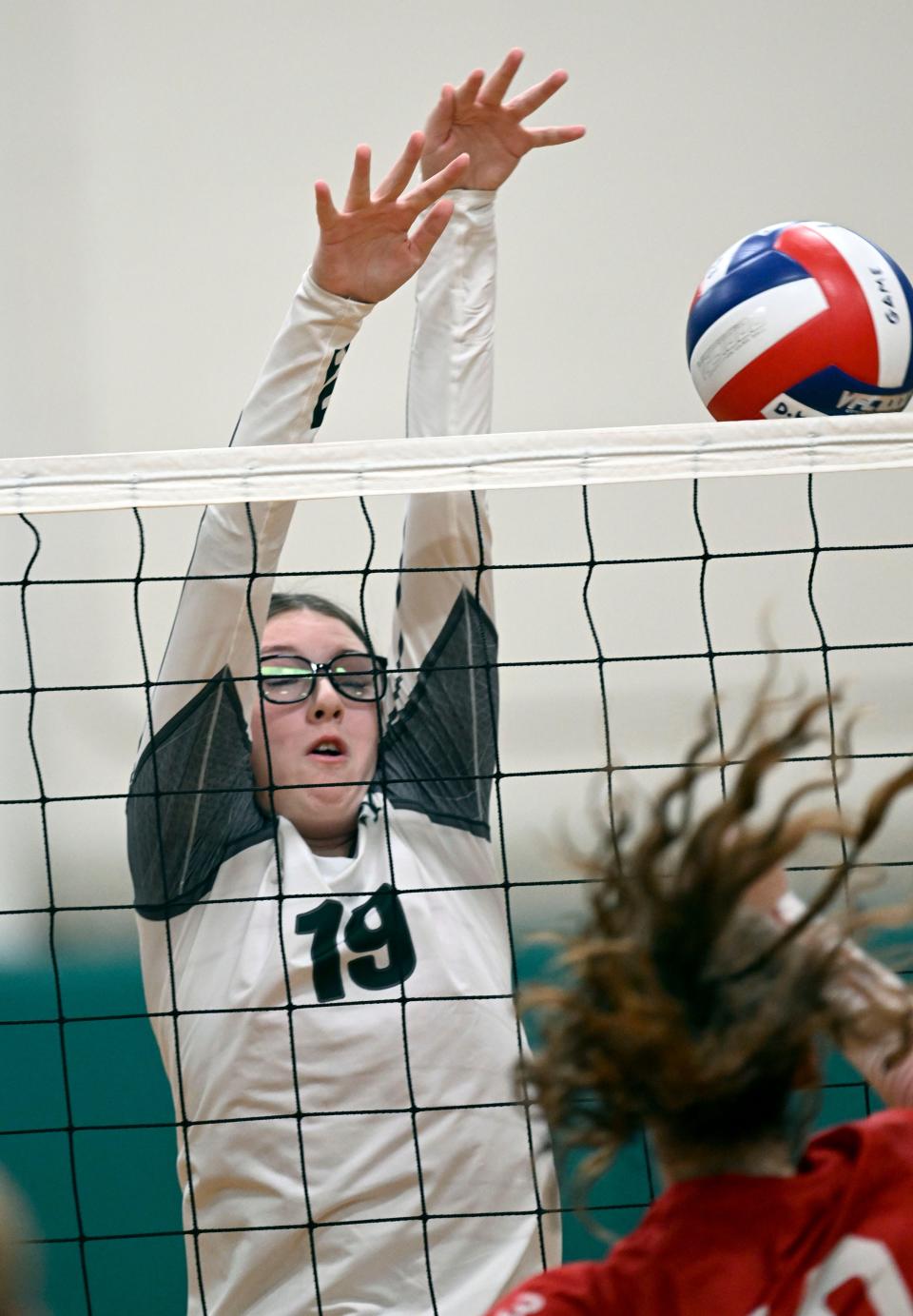 Shauna Baker of D-Y attempts to block a Barnstable shot.