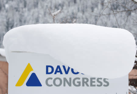 A snow-covered sign is seen in front of the congress centre, the venue of the World Economic Forum (WEF) in Davos, Switzerland Januar 12, 2019. REUTERS/Arnd Wiegmann