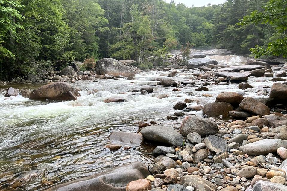 This Tuesday Aug. 15, 2023 photo shows Franconia Brook as it flows several hundred yards below Franconia Falls, in the White Mountain National Forest, in Lincoln, N.H. Authorities say a Massachusetts mother has drowned trying to rescue her young son who was being pulled by the current at Franconia Falls.