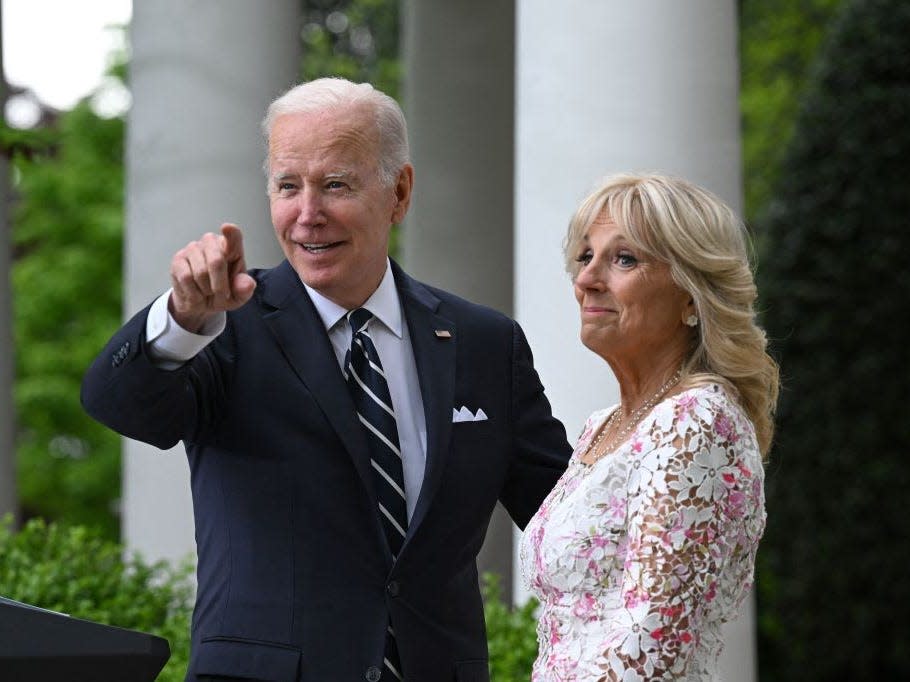 Joe Biden points as Jill Biden stands next to him at the White House