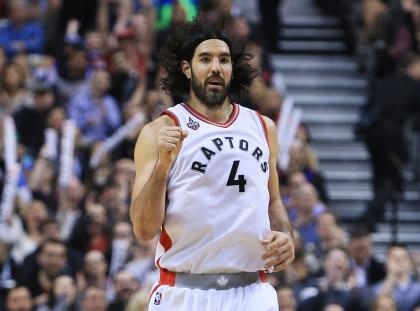 TORONTO, ON - MARCH 18:  Luis Scola #4 of the Toronto Raptors celebrates after sinking a 3-pointer during the first half of an NBA game against the Boston Celtics at the Air Canada Centre on March 18, 2016 in Toronto, Ontario, Canada.  NOTE TO USER: User expressly acknowledges and agrees that, by downloading and or using this photograph, User is consenting to the terms and conditions of the Getty Images License Agreement.  (Photo by Vaughn Ridley/Getty Images)