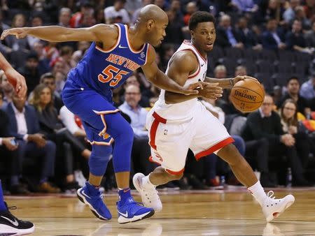 Nov 17, 2017; Toronto, Ontario, CAN; Toronto Raptors guard Kyle Lowry (7) dribbles around New York Knicks guard Jarrett Jack (55) at the Air Canada Centre. Mandatory Credit: John E. Sokolowski-USA TODAY Sports