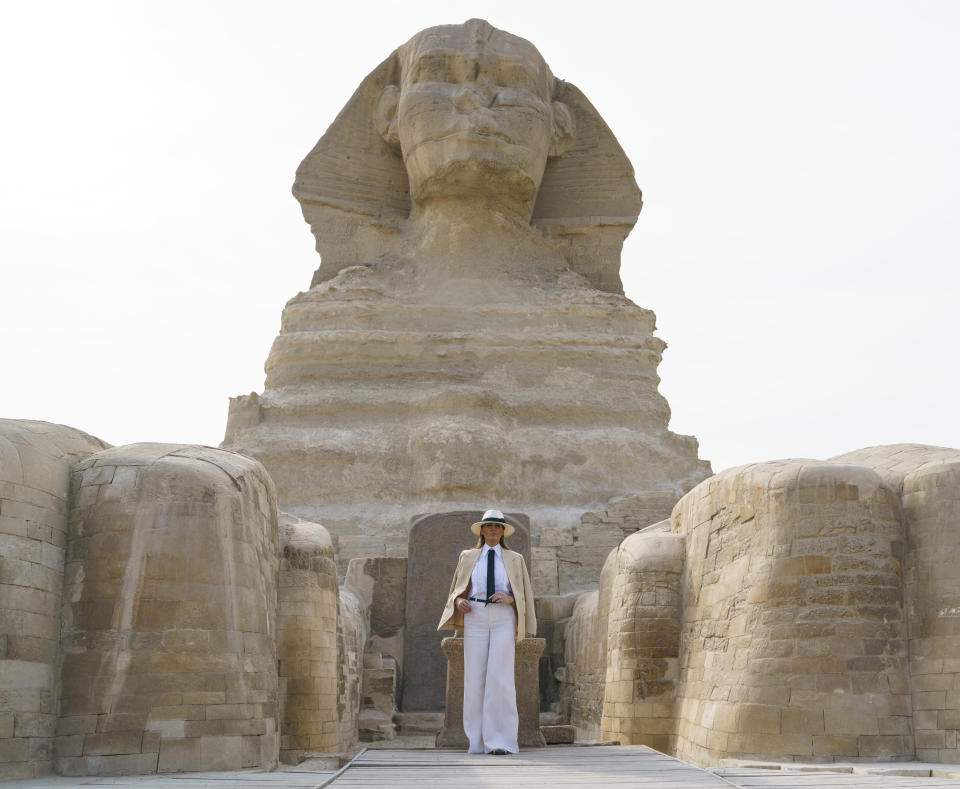 First lady Melania Trump visits the ancient statue of Sphinx, with the body of a lion and a human head, at the historic site of Giza Pyramids in Giza, near Cairo, Egypt, Saturday, Oct. 6, 2018. First lady Melania Trump is visiting Africa on her first big solo international trip. (AP Photo/Carolyn Kaster)