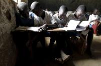 Students attend a class session at the Senator Obama primary school near ancestral home of U.S. President Barack Obama in Nyangoma village in Kogelo, west of Kenya's capital Nairobi, June 23, 2015. REUTERS/Thomas Mukoya