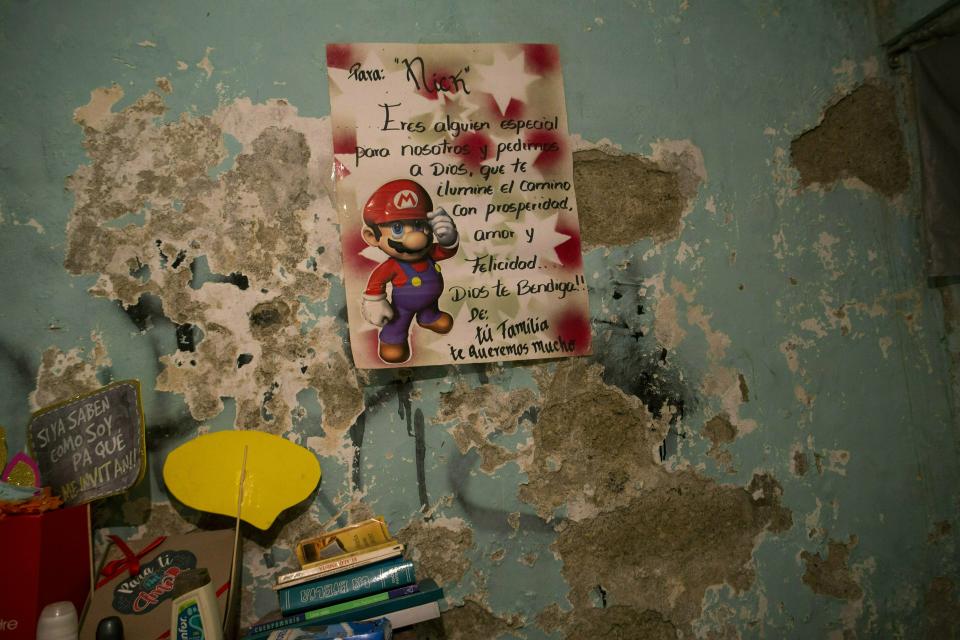 Personal items are seen inside the bedroom of Nick Samuel Oropeza, who was killed when anti-government protests broke out the previous week in Caracas, Venezuela, Sunday, Feb. 3, 2019. A bullet destroyed the 19-year-old's kidney and punctured a lung, according to his mother Ingrid Borjas, a 38-year-old lawyer. (AP Photo/Rodrigo Abd)