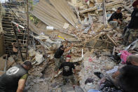 Lebanese soldiers search for survivors after a massive explosion in Beirut, Lebanon, Wednesday, Aug. 5, 2020. .(AP Photo/Hassan Ammar)