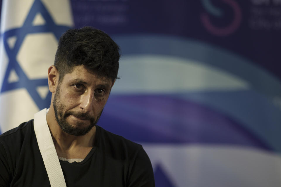 Israeli actor Idan Amedi, well known for his role in the Netflix series "Fauda", listens to a question during a press conference at the Sheba Medical Center in Ramat Gan, Israel, Thursday, Jan. 25, 2024,. Amedi was released from the hospital after being treated for wounds sustained while fighting in the Gaza Strip. (AP Photo/Leo Correa)