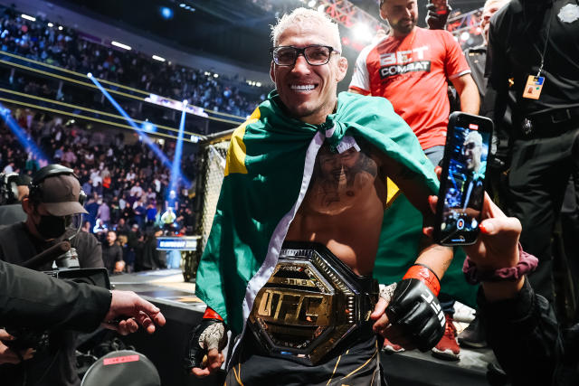 LAS VEGAS, NEVADA - DECEMBER 11: Charles Oliveira of Brazil celebrates after defeating Dustin Poirier to defend his lightweight title during the UFC 269 event at T-Mobile Arena on December 11, 2021 in Las Vegas, Nevada.  (Photo by Carmen Mandato/Getty Images)