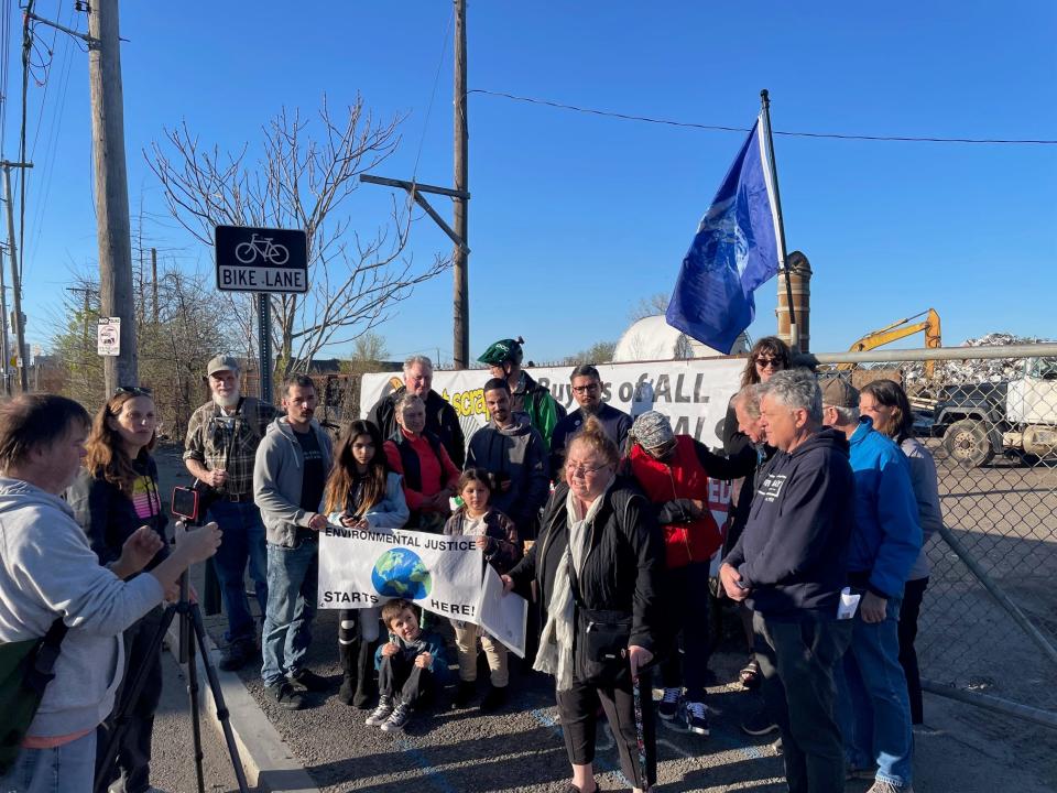 Protesters rally outside Rhode Island Recycled Metals on Tuesday, calling for the Providence scrap-metal business to be shut down over longstanding concerns about health.