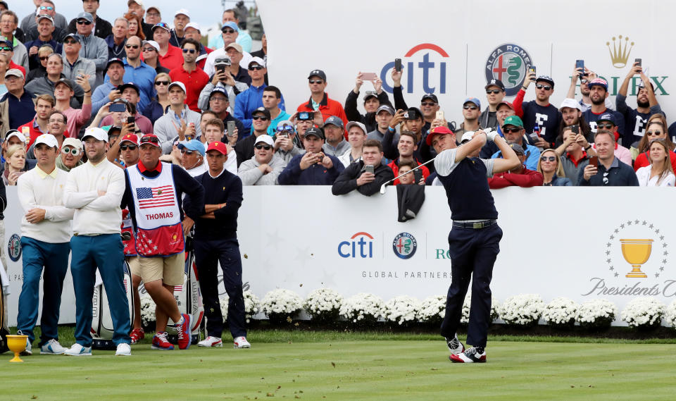 Justin Thomas tees off during Saturday foursome matches of the Presidents Cup at Liberty National Golf Club on September 30, 2017 in Jersey City, New Jersey.