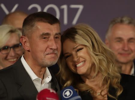 The leader of ANO party Andrej Babis and his wife Monika react during a news conference at the party's election headquarters after the country’s parliamentary elections in Prague, Czech Republic October 21, 2017. REUTERS/David W Cerny
