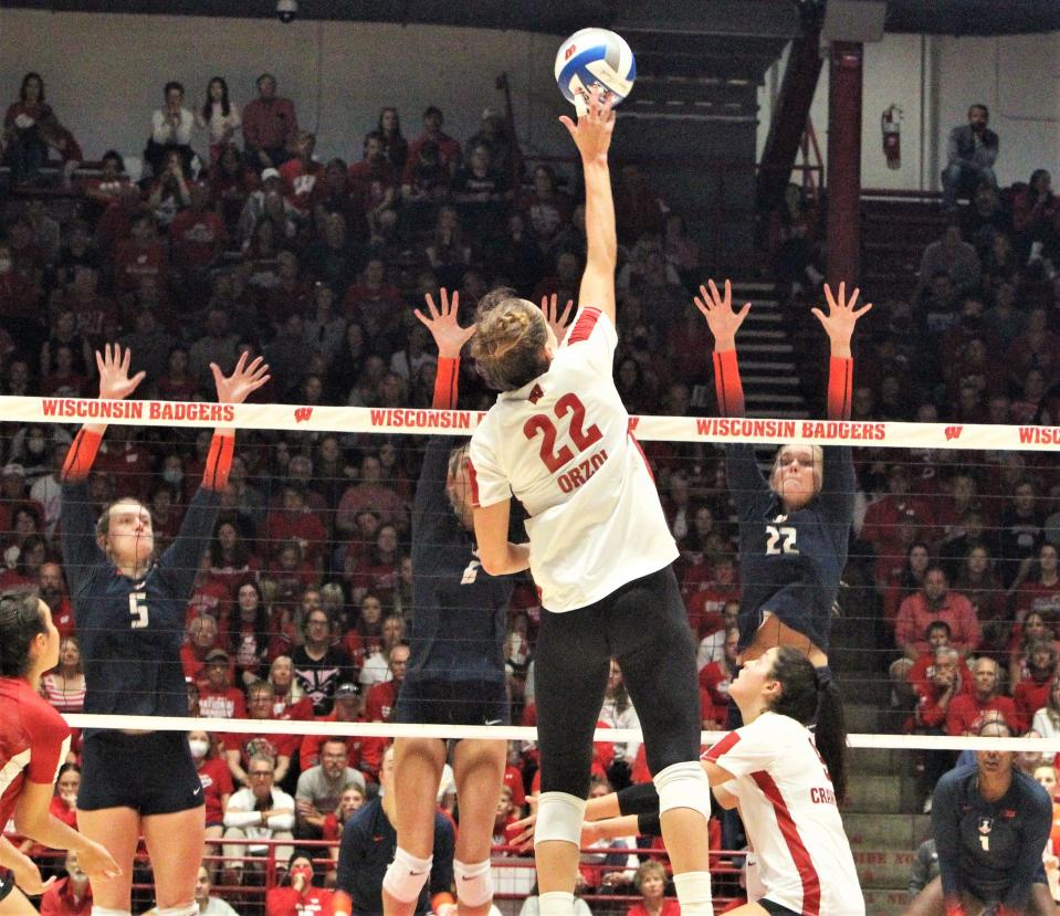 Wisconsin's Julia Orzol hits a shot over the defense during the Badgers' 3-2 win Sunday at the UW Field House.
