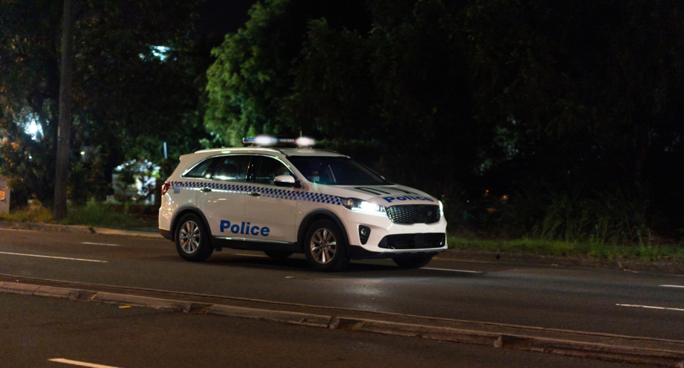 A police car on a road.