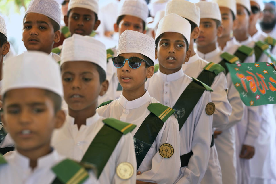 Youngsters in traditional dresses take part in a ceremony celebrating the birthday of Islam's Prophet Muhammad, in Karachi, Pakistan, Friday, Sept. 29, 2023. Thousands of Muslims take part in religious processions, ceremonies and distributing free meals among the poor to mark the holiday. (AP Photo/Fareed Khan)