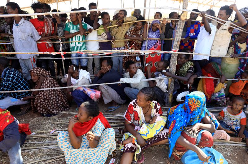 FILE PHOTO: Ethiopians receive supplies at the Um-Rakoba camp on the Sudan-Ethiopia border