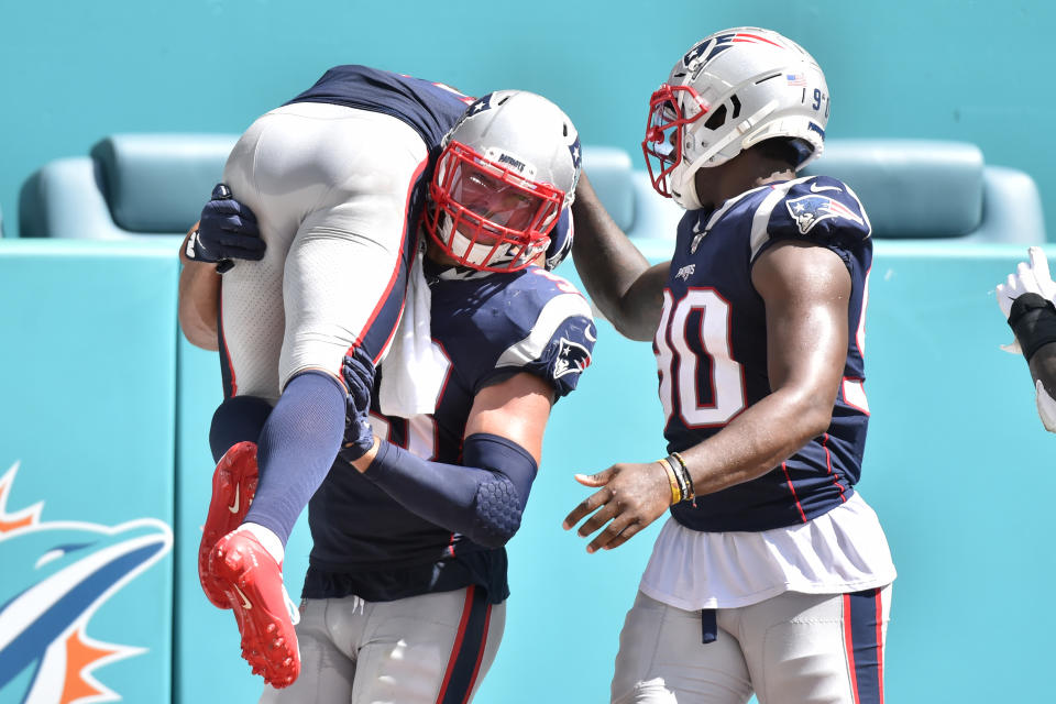 MIAMI, FL - SEPTEMBER 15: Kyle Van Noy #53 of the New England Patriots carries Stephon Gilmore #24 after he returned an interception for a touchdown during the fourth quarter against the Miami Dolphins at Hard Rock Stadium on September 15, 2019 in Miami, Florida. (Photo by Eric Espada/Getty Images)