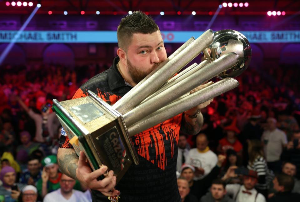 Prize guy: Michael Smith after winning the world title last year at Ally Pally (Getty Images)