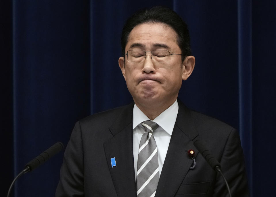 Japanese Prime Minister Fumio Kishida reacts as he speaks during a news conference at the prime minister's office in Tokyo, Japan, Wednesday, Dec. 13, 2023. (Franck Robichon/Pool Photo via AP)