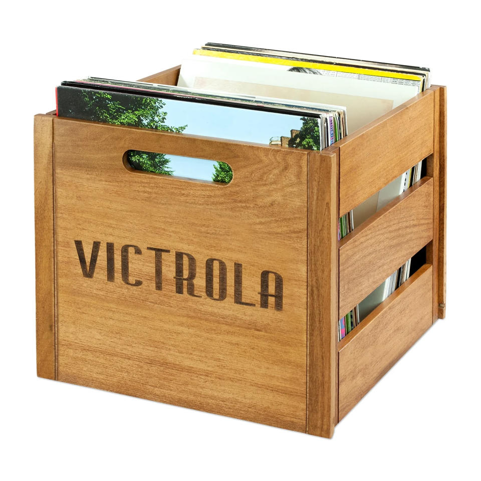 Wooden storage crate by Victrola holding vinyl records