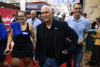 Former Vice President Mike Pence walks through the Varied Industries Building during a visit to the Iowa State Fair, Friday, Aug. 19, 2022, in Des Moines, Iowa. (AP Photo/Charlie Neibergall)