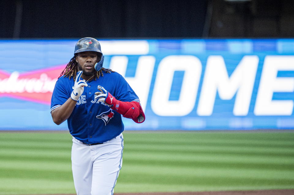 Toronto Blue Jays first baseman Vladimir Guerrero Jr. (27) celebrates after hitting a two-run home run during the first inning of a baseball game against the TSt. Louis Cardinals, Tuesday, July 26, 2022 in Toronto. (Christopher Katsarov/The Canadian Press via AP)