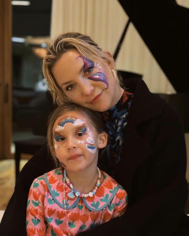 <p>Kate Hudson /Instagram </p> Kate Hudson hugs her daughter Rani to her chest as they sport matching face paint in a photo shared on Instagram.