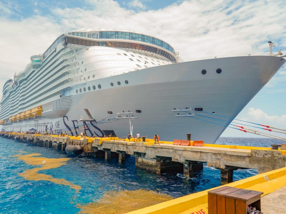 wonder of the seas ship docked on a cloudy day