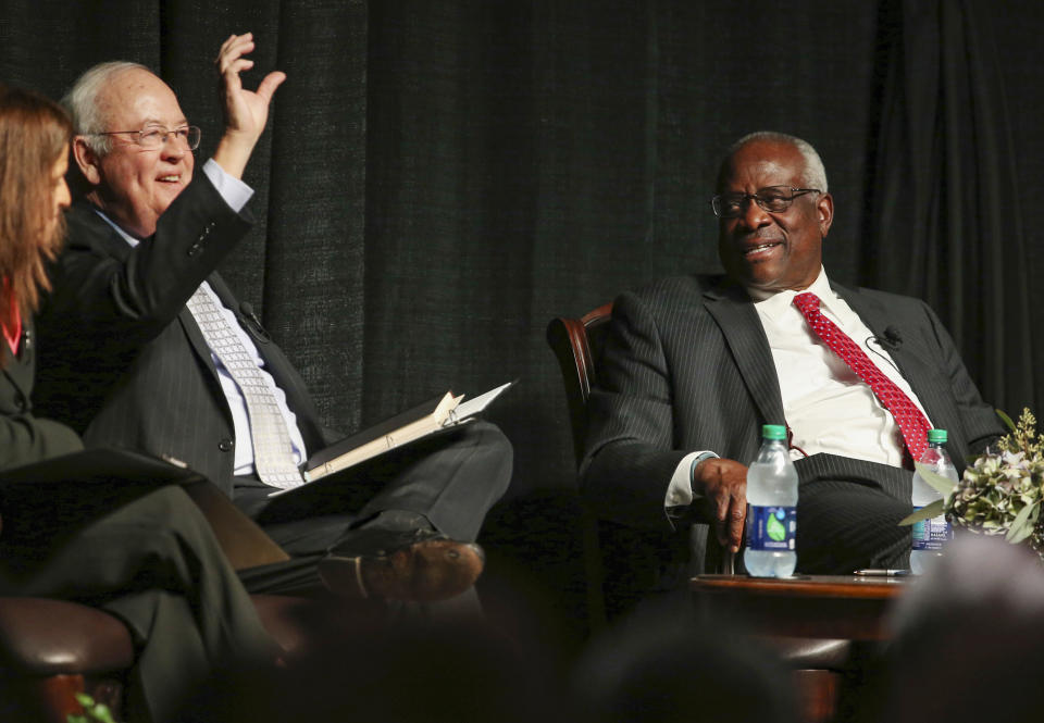 FILE - Former Baylor University president Ken Starr, left, introduces Supreme Court Justice Clarence Thomas, right, to a crowd at McLennan Community College in Waco, Texas, Sept. 7, 2017. (Rod Aydelotte/Waco Tribune-Herald via AP)