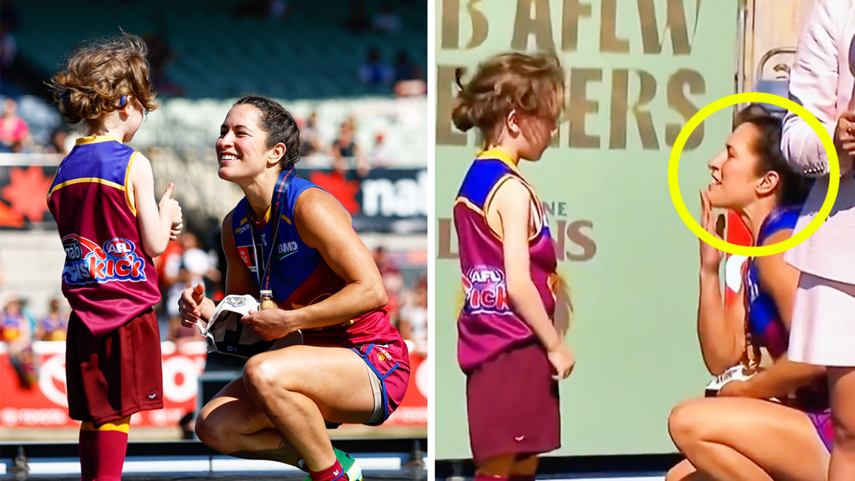 Ally Anderson uses sign with a young footy fan.