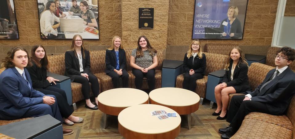 The Cheboygan DECA team poses for a photo at the district competition at Saginaw Valley State University.