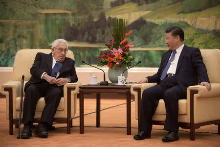 Former U.S. Secretary of State Henry Kissinger (L) meets China's President Xi Jinping at the Great Hall of the People in Beijing, China December 2, 2016. REUTERS/Nicolas Asouri/Pool