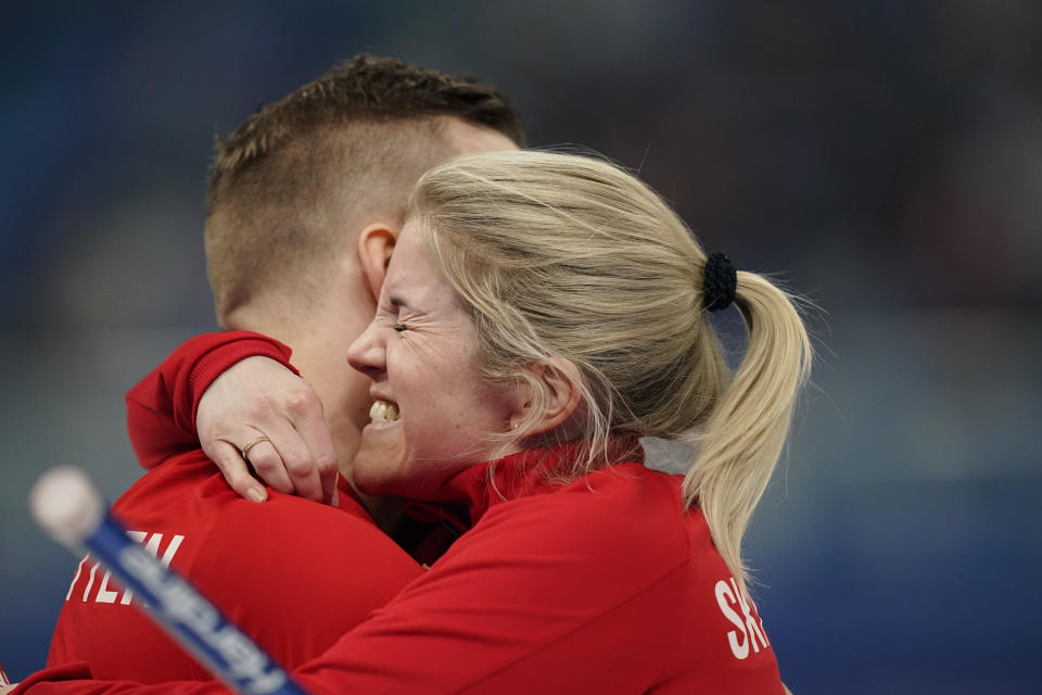 Kristin Skaslien, of Norway, celebrates with teammate Magnus Nedregotten, after a win against Britain during the semi-finals round of the mixed doubles curling match against at the Beijing Winter Olympics Monday, Feb. 7, 2022, in Beijing. (AP Photo/Brynn Anderson)