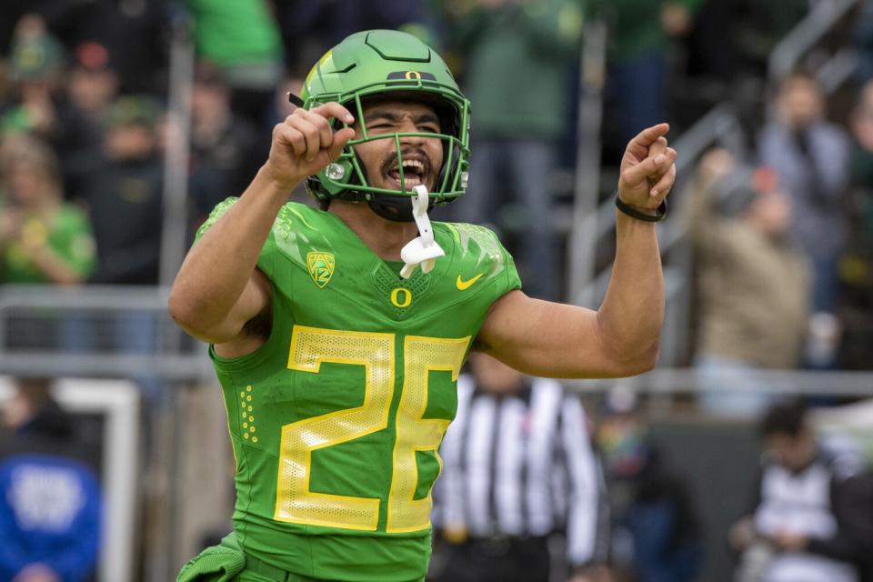 Oregon running back Travis Dye celebrates a touchdown against Oregon State on Nov. 27.