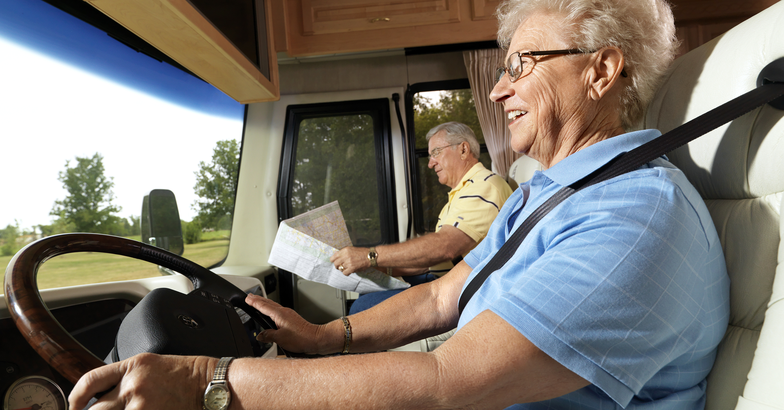 Senior couple driving an RV