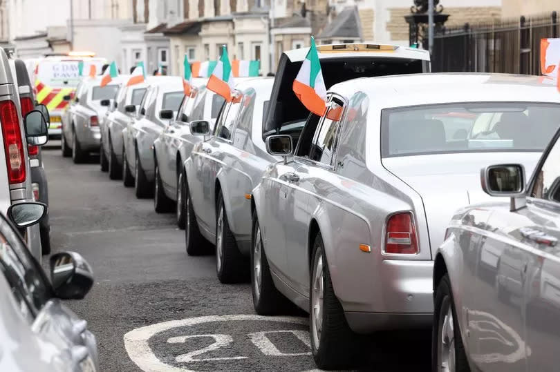 Rolls Royce cars decorated in Irish flags lined the streets of Cardiff in celebration of Jim Coffey's life on Monday