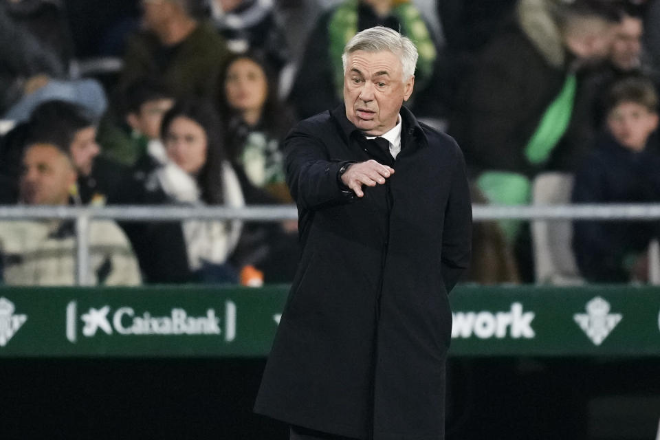 Real Madrid's head coach Carlo Ancelotti gestures during the Spanish La Liga soccer match between Real Betis and Real Madrid at the Benito Villamarin stadium in Seville, Spain, Sunday, March 5, 2023. (AP Photo/Jose Breton)